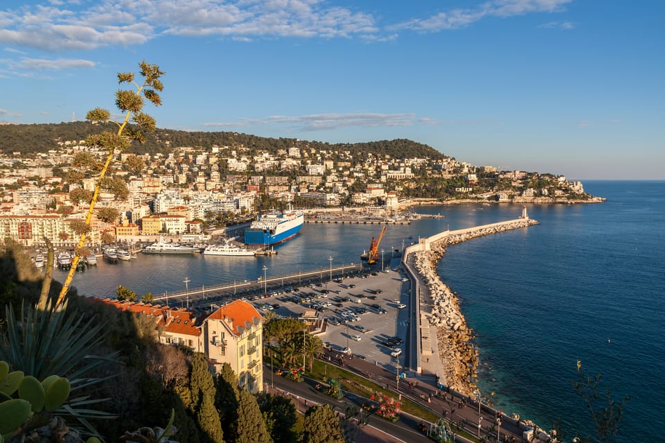 Nice: Old Town Treasures and Castle Hill Walking Tour - Entering Vieux Nice through an old gate and noble-era buildings